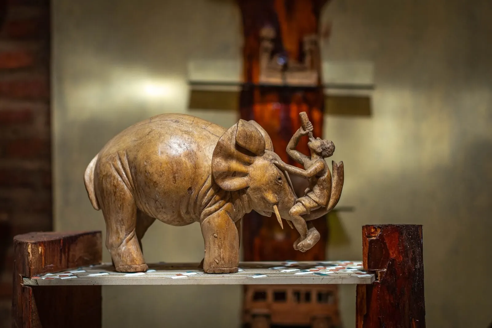 Horizontal artwork with detailed carving by Thelmah Kutinyu